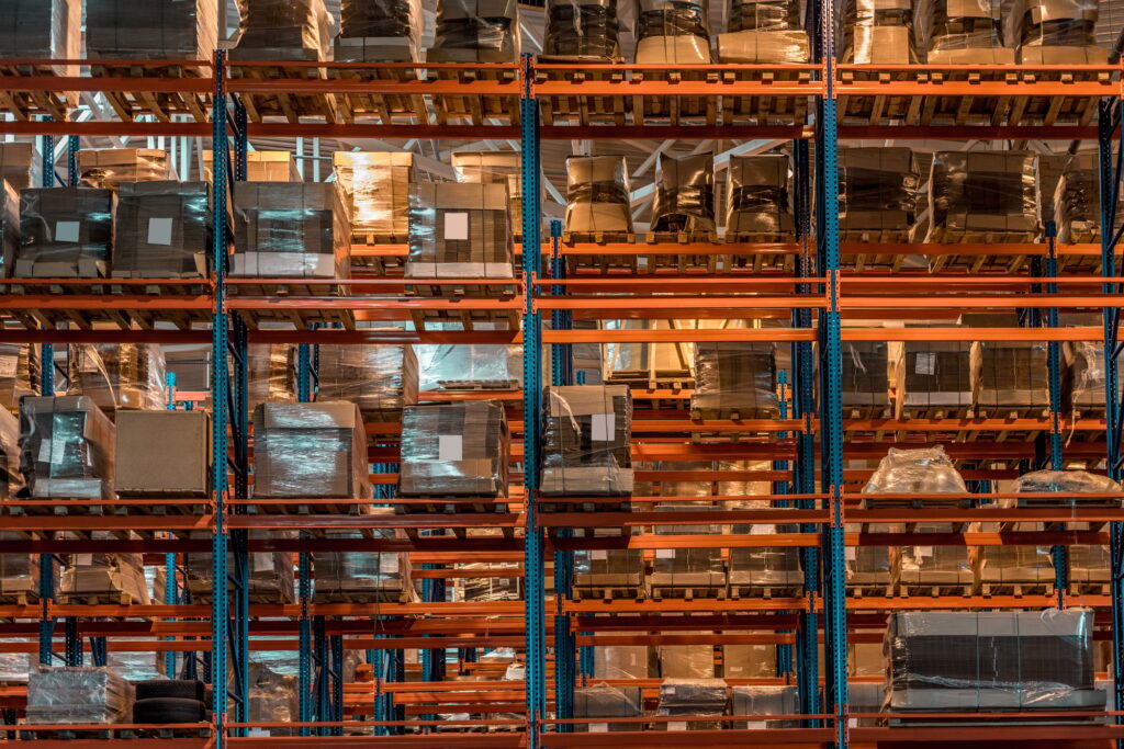 boxes and containers on shelves in modern warehouse
